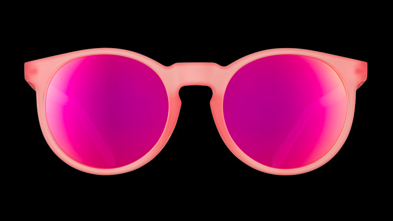 Front view of round pink sunglasses with polarised pink reflective lenses.