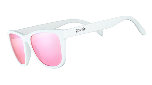 Three-quarter angle view of square-shaped white sunglasses with non-reflective rose-tinted lenses.