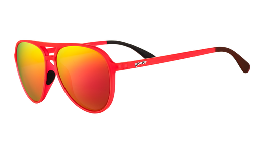 Three-quarter angle view of red aviator sunglasses with bright red mirrored lenses and black silicone inner nose & ear grips.