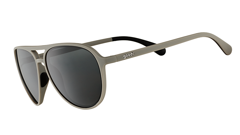 Three-quarter angle view of matte gray aviator sunglasses with non-reflective black lenses on a white background.