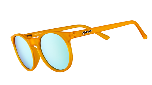 Three-quarter angle view of round orange sunglasses with light blue reflective polarised lenses.