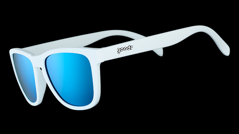 Three-quarter angle view of square-framed white sunglasses with blue reflective polarised lenses.