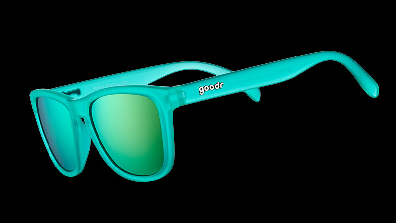 Three-quarter angle view of square-shaped teal sunglasses with teal reflective polarised lenses.