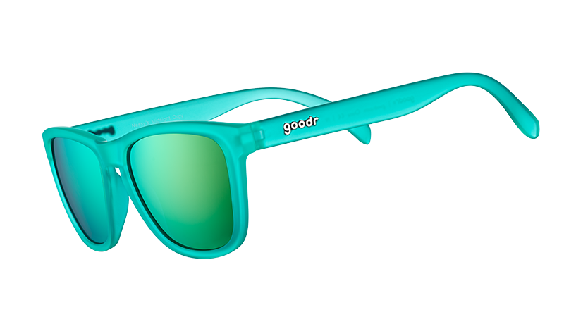 Three-quarter angle view of square-shaped teal sunglasses with teal reflective polarised lenses.