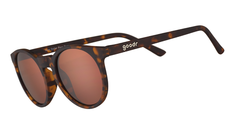 Three-quarter angle view of round brown tortoiseshell sunglasses with non-reflective brown circle-shaped lenses.