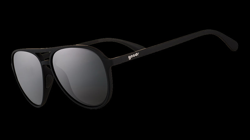 Three-quarter angle view of black aviator sunglasses with black non-reflective lenses.