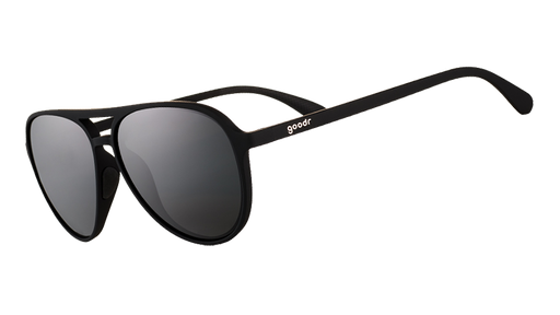 Three-quarter angle view of black aviator sunglasses with black non-reflective lenses.