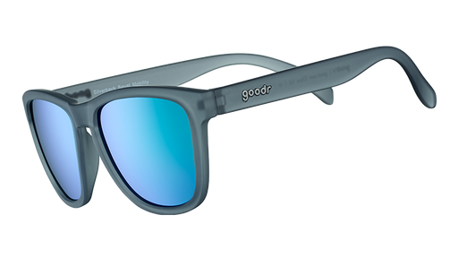 Three-quarter angle view of square-shaped sunglases with a gray translucent frame and green reflective lenses.