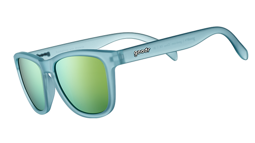 Three-quarter angle view of square-shaped sunglasses with light blue translucent frames and gold reflective lenses.