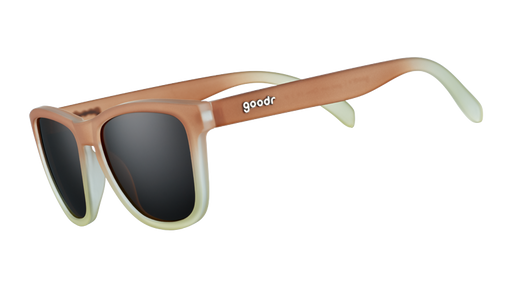 Three-quarter angle view of square-shaped sunglasses with brown-to-white gradient frames and brown, non-reflective lenses.
