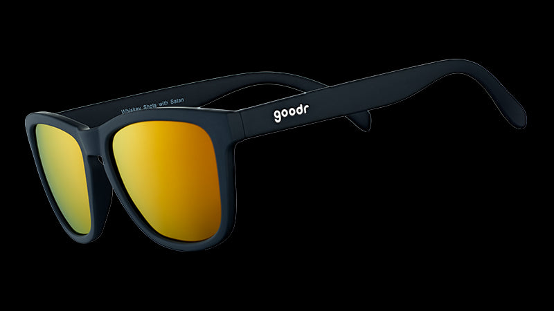 Three-quarter angle view of square-shaped black sunglasses with mirrored amber lenses.