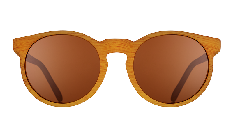 Front view of brown wood grain patterned round sunglasses with circular brown non-reflective lenses.