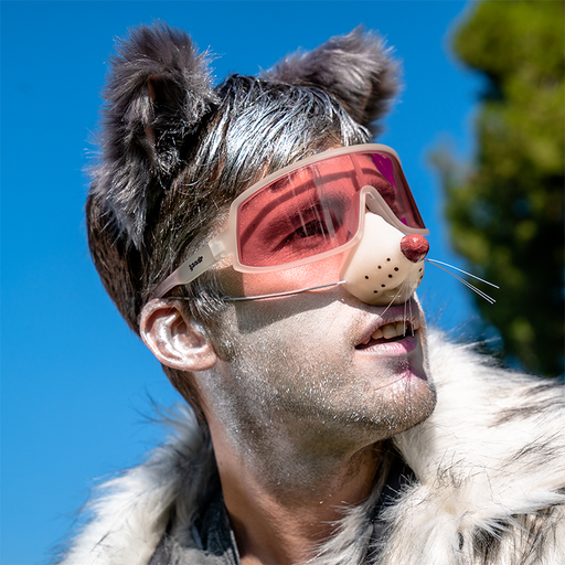 A man in a possum outfit wearing clear wraparound sunglasses with a rose-tinted single lens looks into the distance.