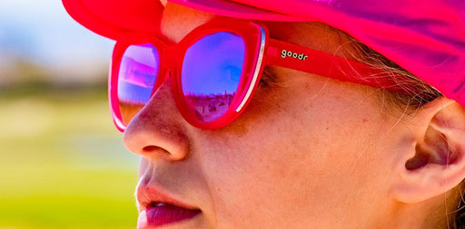 Woman wearing Goodr Sand Trap Queen Golf Sunglasses